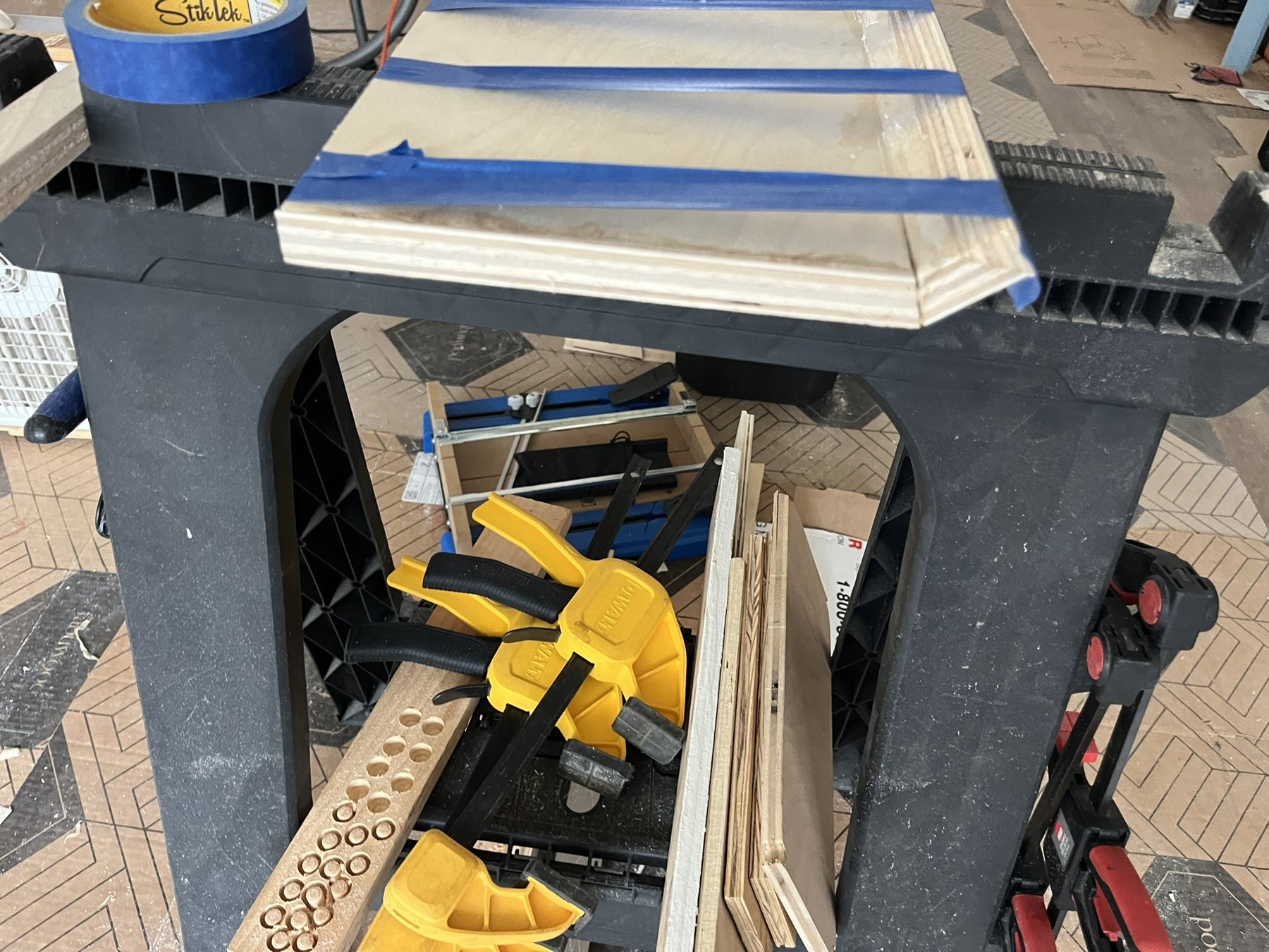 Trim assembly supported on a workbench during fitting