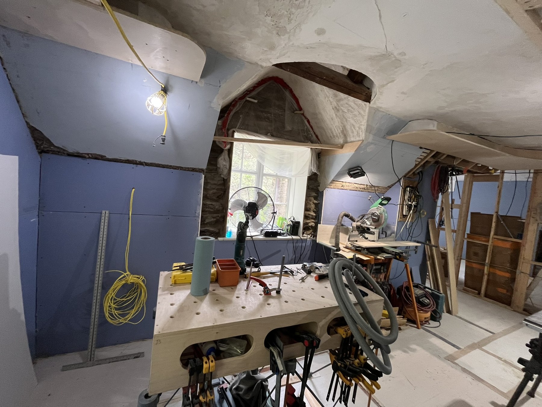 Curved dormer enclosure taking shape around exposed timbers