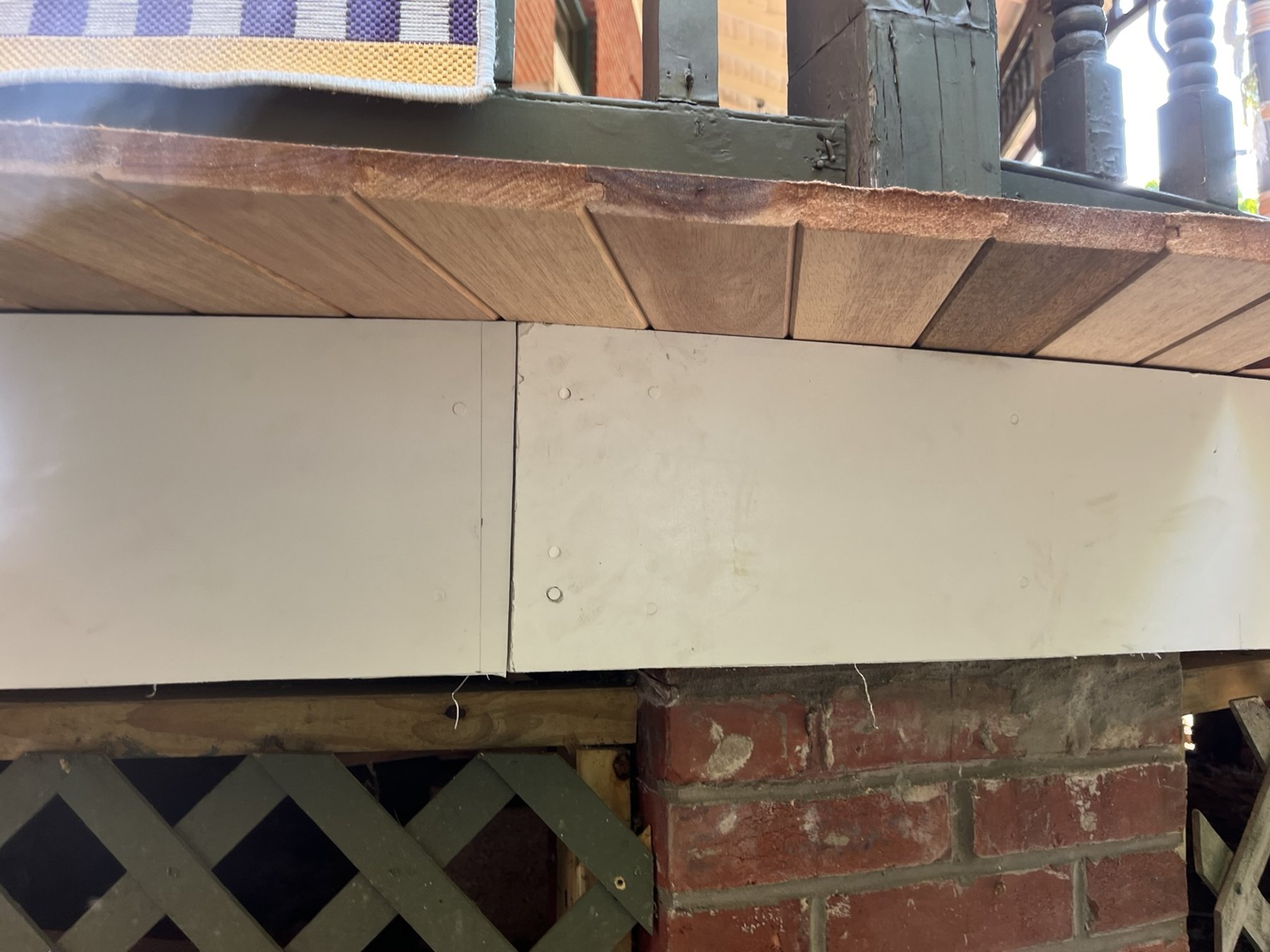New porch fascia fitted over an existing brick pier