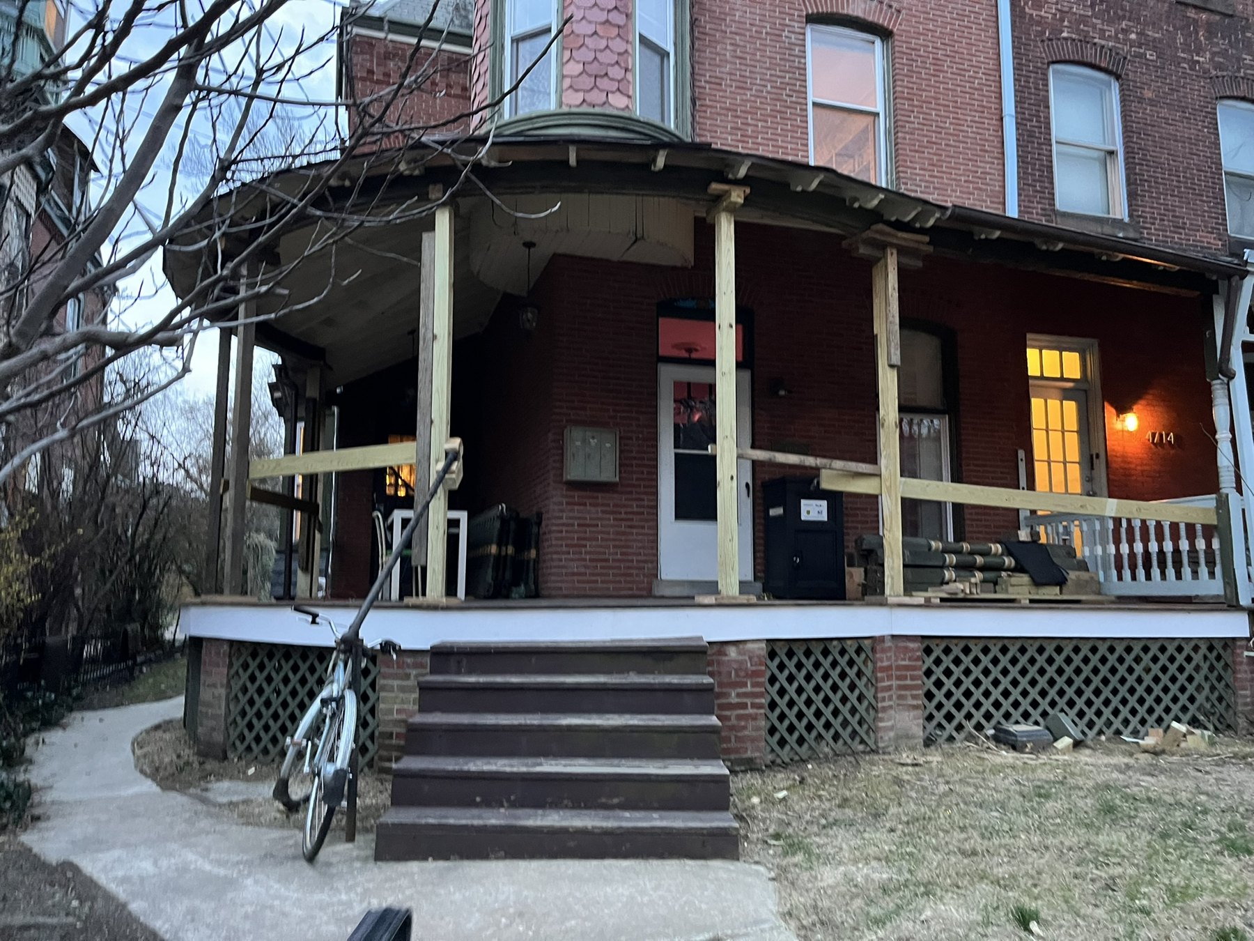 Victorian porch with temporary supports during restoration